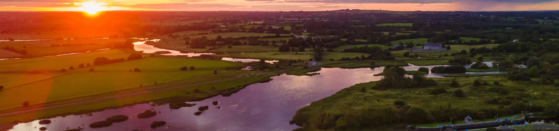 Meelick Weir Walkway on River Shannon by sunset